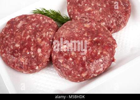 minced meat in plastic package isolated on white background Stock Photo