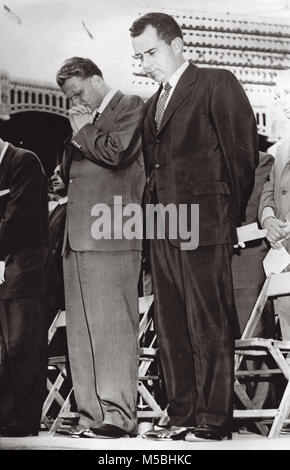Evangelist Billy Graham and Vice President Richard Nixon bow heads in prayer during the climax of Billy Graham's evangelistic gathering July 20, 1958 at Yankee Stadium in New York City with an estimated 85,000 people in the stadium and another 2500 standing outside the ballpark. Stock Photo