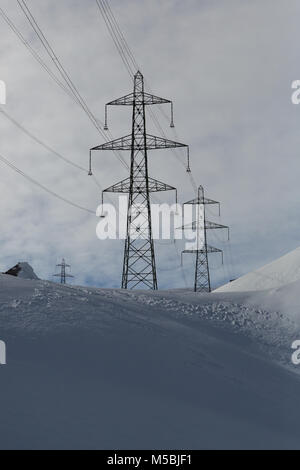 Electricity pylons in winter mountains in Bulgaria Stock Photo - Alamy
