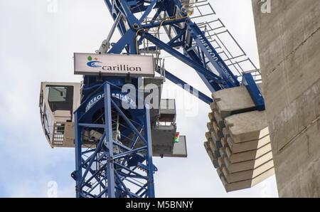 Carillion sign on an empty crane on a deserted building site, Salford, Greater Manchester. Carillion plc is a British multinational facilities managem Stock Photo