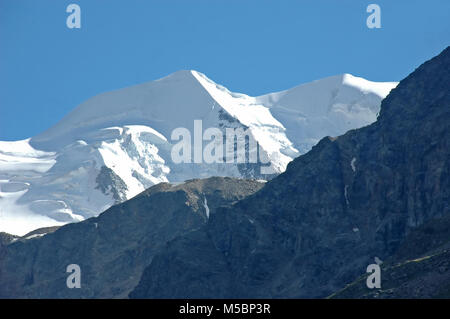 The magnificent ice covered peaks of Piz Bernina in the southern swiss alps above St Moritz Stock Photo