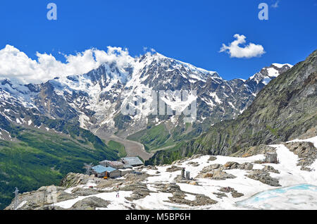 Italy's highest peak, The Monte Rosa, viewed from the Monte Moro Pass in the summer with ice lake in the foreground Stock Photo