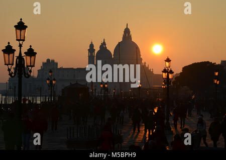 Sunset in Venice over the basilica of Santa Maria della Salute, viewed from St Mark's Square. Stock Photo