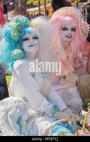 April  19, 2014, Haarzuilens, The Netherlands: Beautifully dressed young ladies with wigs of pink and blue hair at the Elf Fantasy Fair (Elfia), an ou Stock Photo