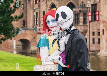 April  19, 2014, Haarzuilens, The Netherlands: Man with scary mask and scary red-haired girlfriend  with a big spider around their necks at the Elf Fa Stock Photo