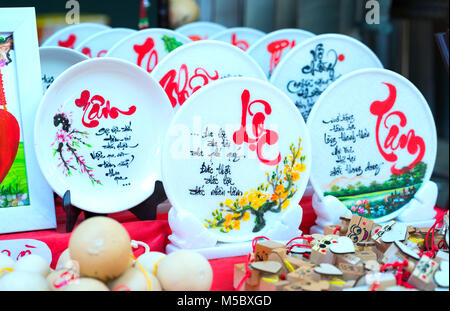 Written speaker sentence Lunar New Year art of ceramics with text 'Happy, Merit, Fortune, Longevity, Peace' in Vietnamese used to decorate indoors Stock Photo