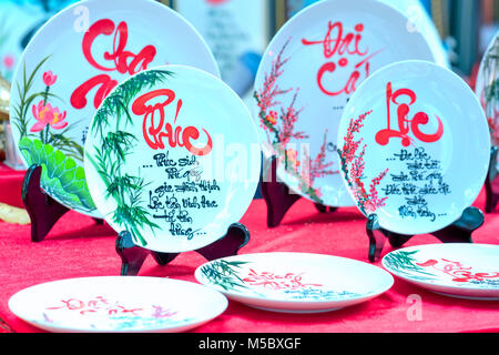 Written speaker sentence Lunar New Year art of ceramics with text 'Happy, Merit, Fortune, Longevity, Peace' in Vietnamese used to decorate indoors Stock Photo