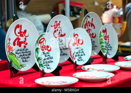 Written speaker sentence Lunar New Year art of ceramics with text 'Happy, Merit, Fortune, Longevity, Peace' in Vietnamese used to decorate indoors Stock Photo