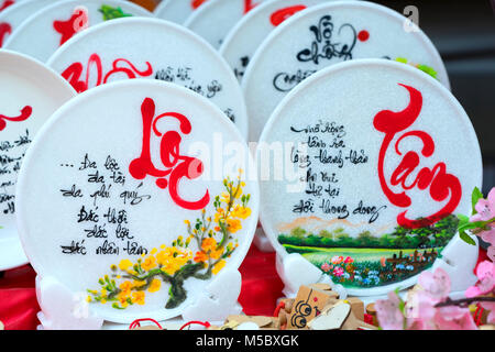 Written speaker sentence Lunar New Year art of ceramics with text 'Happy, Merit, Fortune, Longevity, Peace' in Vietnamese used to decorate indoors Stock Photo