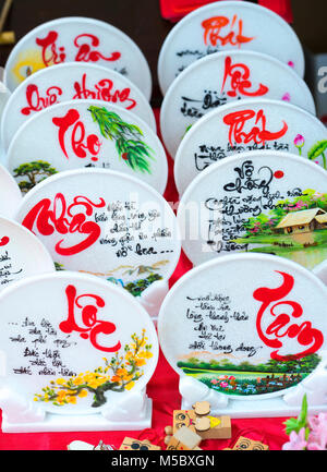 Written speaker sentence Lunar New Year art of ceramics with text 'Happy, Merit, Fortune, Longevity, Peace' in Vietnamese used to decorate indoors Stock Photo