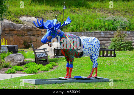 A statue of an artistic moose named 'Url' the the View - the Art Center, Old Forge, NY USA, a gift to the View and decorated by area students. Stock Photo