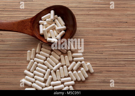 Spoon full of variety medicine pills Stock Photo