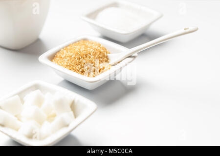 Different types of sugars in the white bowls Stock Photo