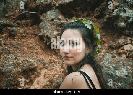 forest elf with plants in her hair, natural make-up Stock Photo