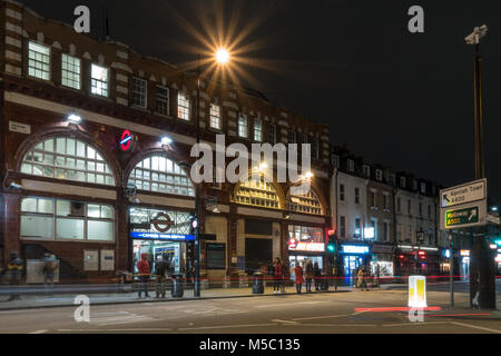 London, England, UK - January 8, 2018: Commuters walk along Kentish Town Road to Camden Town London Underground station in north London. Stock Photo