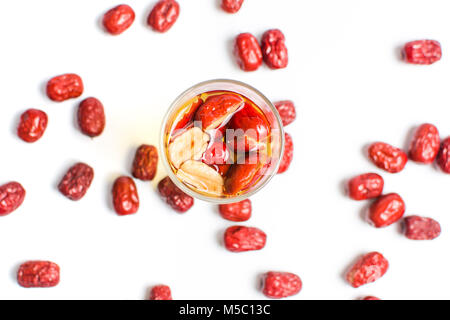 Chinese red dates fruit tea in a glass on white Stock Photo