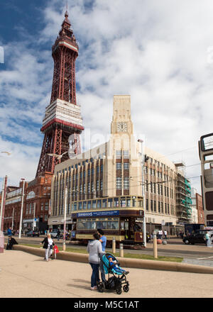 Blackpool, England, UK - August 1, 2015: A traditional double decker electric tram runs along the Blackpool Tramway on Blackpool Promenade under the i Stock Photo