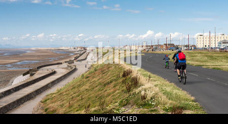 Blackpool, England, UK - August 1, 2015: Cyclists ride on the sea wall and cliff tops between Blackpool and Fleetwood on a summer day. Stock Photo