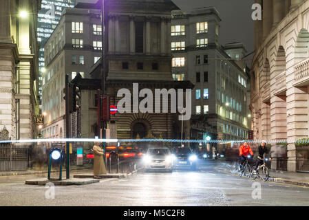 London, England, UK - January 11, 2018: Traffic waits at signals at Bank junction in the city of London, with St Mary Woolnoth church and office block Stock Photo