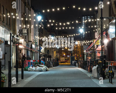 London, England, UK - February 5, 2018: Strings of lights hang above Exmouth Market, a pedestrianised shopping street in Islington, London. Stock Photo