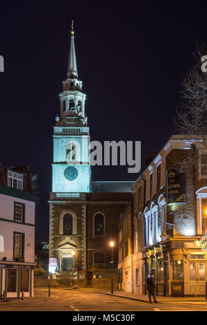 London, England, UK - February 9, 2018: The spire of St James's Church is lit up at night on Clerkenwell Green in central London. Stock Photo