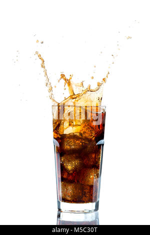 Ice splashing on a glass of a Cola drink against a white background Stock Photo