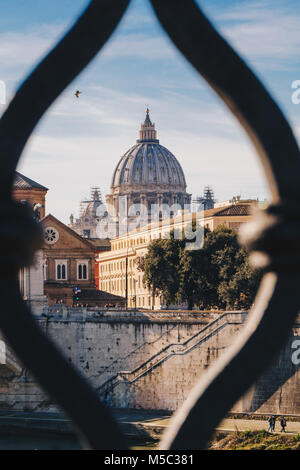 Basilica St. Peter in Vatican as seen from Sant' Angelo Bridge in Rome, Italy. Focus on the Basilica Stock Photo