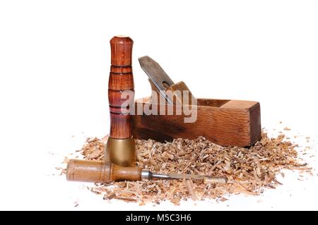 Wood tools and chips on white background. Stock Photo