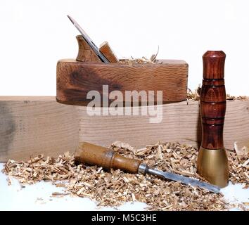 Chisel and different woodwork tools with wooden chips in close-up Stock Photo