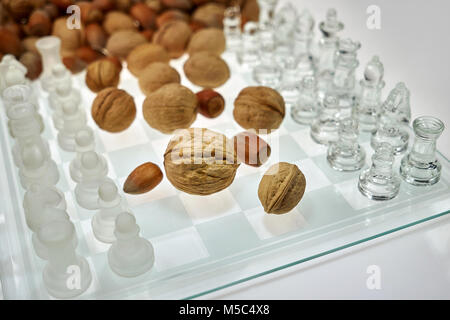 Nuts improve brain efficiency (visualization) - chess, chessboard with nuts Stock Photo