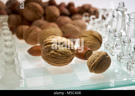 Nuts improve brain efficiency (visualization) - chess, chessboard with nuts Stock Photo