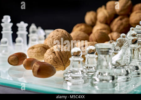 Nuts improve brain efficiency (visualization) - chess, chessboard with nuts Stock Photo