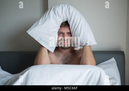 Caucasian man suffering from insomnia Stock Photo