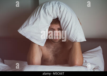 Caucasian man suffering from insomnia Stock Photo