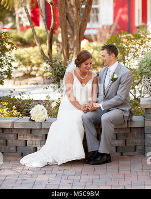 newly married couple having private moment in the garden Stock Photo