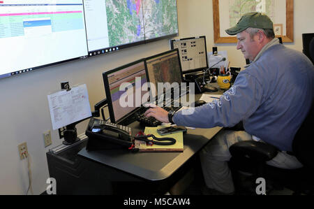 Range Control Technician Mark Confer with the Directorate of Plans, Training, Mobilization and Security works at the Fire Desk on Jan. 16, 2018, at Fort McCoy, Wis. The desk operates communications with units using the range complex as well as Range Maintenance and other personnel throughout 46,000 acres of training areas on Fort McCoy. (U.S. Army Stock Photo