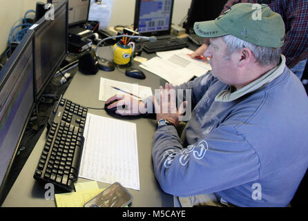 Range Control Technician Mark Confer with the Directorate of Plans, Training, Mobilization and Security works at the Fire Desk on Jan. 16, 2018, at Fort McCoy, Wis. The desk operates communications with units using the range complex as well as Range Maintenance and other personnel throughout 46,000 acres of training areas on Fort McCoy. (U.S. Army Stock Photo