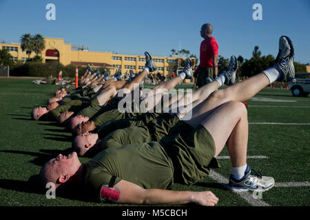 Recruits with Charlie Company, 1st Recruit Training Battalion, perform an exercise during a physical training session at Marine Corps Recruit Depot San Diego, Jan. 23. The recruits performed multiple exercises upon completion of a 400-meter dash. Annually, more than 17,000 males recruited from the Western Recruiting Region are trained at MCRD San Diego. Charlie Company is scheduled to graduate April 6. Stock Photo