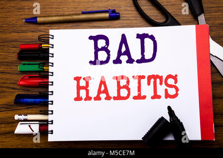 Handwriting Announcement text showing Bad Habits. Business concept for Improvement Break Habitual Hebit Written on notebook, wooden background office  Stock Photo