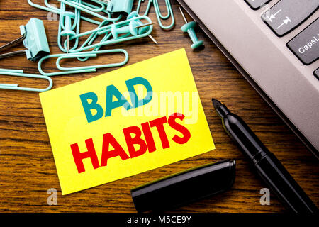 Handwriting Announcement text showing Bad Habits. Business concept for Improvement Break Habitual Hebit written on sticky note paper on wooden backgro Stock Photo