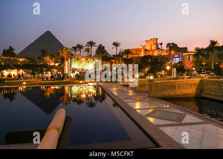 Evening or night time view of the Mena House Hotel, with the Pyramids in the background, Giza, Cairo, Egypt, North Africa
