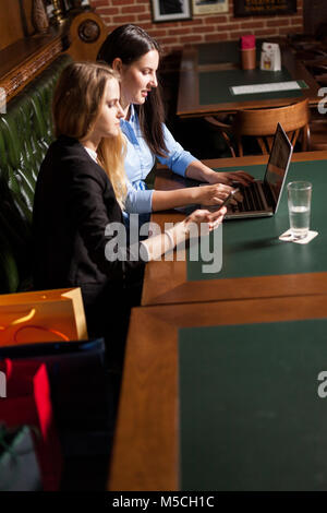 Business women sit in a conference room and having a online talk with shareholders and partners Stock Photo
