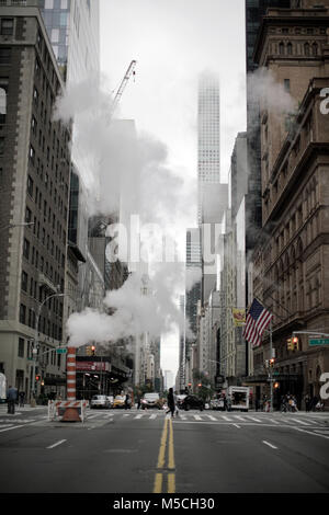 Steam and smoke coming from tall chimneys at coal burning power plant ...