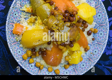 Traditional vegetarian couscous prepared for eating in a plate in Moroccan restaurant Stock Photo