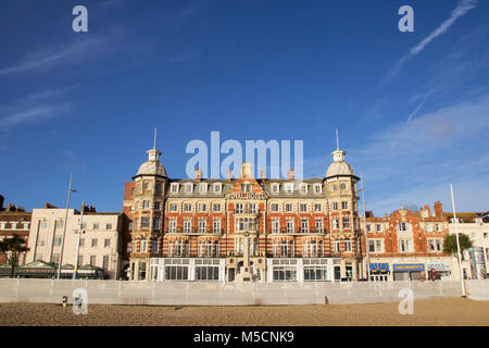 WEYMOUTH, DORSET, UK - DECEMBER 26, 2017. View of the Victorian Royal Hotel along the Esplanade promenade with a war memorial in the foreground, Weymo Stock Photo