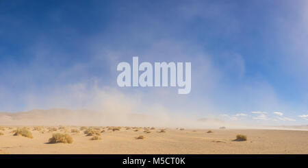 Strong winds blow a massive sandstorm across the open desert of the southwest. Stock Photo