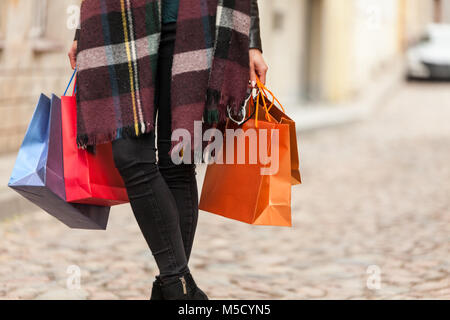 Girl holds many bags from shop Stock Photo