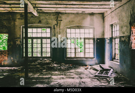 Abandoned textile factory in Latvia, view from an open door. Stock Photo