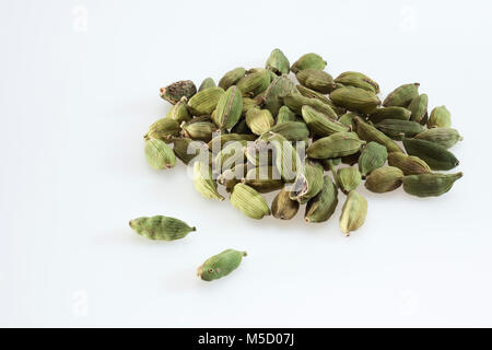 Green cardamom pods on a clean white background Stock Photo
