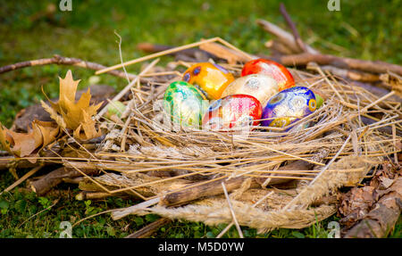 Six colorful painted Easter eggs in a nest Stock Photo